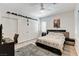 Bright bedroom with a ceiling fan, wardrobe, a grey rug, and a headboard with an elegant design at 2496 Ram Crossing Way, Henderson, NV 89074