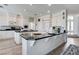 Spacious kitchen featuring dual islands, modern appliances, and a clean, all-white aesthetic at 2496 Ram Crossing Way, Henderson, NV 89074
