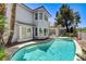 Private pool and spa with well-maintained backyard and views of the home at 2496 Ram Crossing Way, Henderson, NV 89074