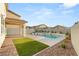 Private backyard retreat featuring a sparkling pool, modern patio, and landscaped surroundings at 2833 Sangro Ct, Henderson, NV 89044