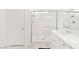 Modern bathroom with white cabinetry and a glass door shower at 2833 Sangro Ct, Henderson, NV 89044