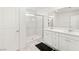 Clean, bright bathroom with dual sinks and a glass-enclosed shower at 2833 Sangro Ct, Henderson, NV 89044
