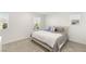 Inviting bedroom with plush carpet, a soft upholstered bed, and windows for natural light at 2833 Sangro Ct, Henderson, NV 89044