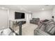 Spacious living room with plush seating, large TV, and modern decor at 2833 Sangro Ct, Henderson, NV 89044