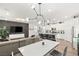 Bright and modern living room featuring sleek furnishings and a stylish kitchen island at 2833 Sangro Ct, Henderson, NV 89044