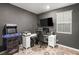 Functional home office featuring a large monitor, arcade game, and organized workspace at 2833 Sangro Ct, Henderson, NV 89044