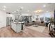 Open concept living area featuring a modern kitchen, dining area, and living room with natural light at 2833 Sangro Ct, Henderson, NV 89044