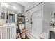 Cozy bathroom featuring glass-enclosed shower, modern vanity, and essential storage at 2915 Cedar Ave # 11C, Las Vegas, NV 89101