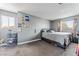 Comfortable bedroom featuring natural light, neutral gray walls, and soft carpeting at 2915 Cedar Ave # 11C, Las Vegas, NV 89101