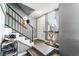 Inviting entryway with a modern table, stylish decor, wood-look floors, and staircase at 2915 Cedar Ave # 11C, Las Vegas, NV 89101