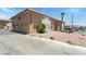 Spacious front yard featuring clean exterior of a two-story building and ample parking at 2915 Cedar Ave # 11C, Las Vegas, NV 89101