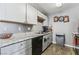 Well-lit kitchen with gray cabinets, granite countertops, and modern appliances at 2915 Cedar Ave # 11C, Las Vegas, NV 89101