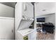 Convenient laundry closet with stacked washer and dryer off of the open-concept living area at 2915 Cedar Ave # 11C, Las Vegas, NV 89101