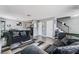 Open-concept living area featuring sleek sofas, modern rug, and staircase to the upper level at 2915 Cedar Ave # 11C, Las Vegas, NV 89101
