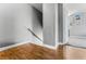 Well-lit staircase featuring modern wood-style flooring and a decorative railing at 2915 Cedar Ave # 11C, Las Vegas, NV 89101