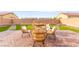 Outdoor seating area featuring stylish furniture on a brick patio, surrounded by artificial grass and block wall at 3524 Colby Creek Ave, North Las Vegas, NV 89081