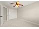 Bedroom features plush carpeting, ceiling fan with light kit, and a closet with sliding doors at 3524 Colby Creek Ave, North Las Vegas, NV 89081