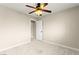 Neutral bedroom featuring a ceiling fan, carpet, and a door leading to the rest of the house at 3524 Colby Creek Ave, North Las Vegas, NV 89081