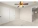 This bedroom features carpet and a ceiling fan, as well as a closet with sliding doors at 3524 Colby Creek Ave, North Las Vegas, NV 89081