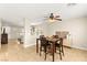 Bright dining area featuring tile floors and a dark wood dining table at 3524 Colby Creek Ave, North Las Vegas, NV 89081