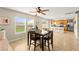 Dining area with tile flooring and natural light, open to the kitchen area at 3524 Colby Creek Ave, North Las Vegas, NV 89081