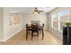 Dining room with tile flooring and natural light, featuring backyard views at 3524 Colby Creek Ave, North Las Vegas, NV 89081