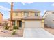 Inviting two-story home with a neutral color palette, tile roof, and well-kept landscaping at 3524 Colby Creek Ave, North Las Vegas, NV 89081