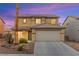 Charming two-story home featuring a well-manicured front yard with a two car garage at 3524 Colby Creek Ave, North Las Vegas, NV 89081
