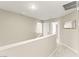 Well-lit hallway with neutral colors, carpet, and easy access to rooms at 3524 Colby Creek Ave, North Las Vegas, NV 89081