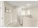 Hallway area with neutral tones, carpeted floor, and three doors at 3524 Colby Creek Ave, North Las Vegas, NV 89081
