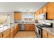Well-lit kitchen featuring stainless steel appliances, granite countertops, and lots of natural light at 3524 Colby Creek Ave, North Las Vegas, NV 89081