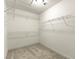 Walk-in closet, offering adjustable wire shelving and carpeted floor at 3524 Colby Creek Ave, North Las Vegas, NV 89081