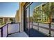 Balcony view featuring the neighborhood and architectural features with tall palm trees at 353 E Bonneville Ave # 449, Las Vegas, NV 89101