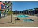 Inviting community pool and hot tub with palm trees and comfortable seating, creating a resort-like atmosphere at 353 E Bonneville Ave # 449, Las Vegas, NV 89101