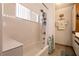 Well-lit bathroom featuring tub and shower with white tile and a shower head at 3550 Bay Sands Dr # 3089, Laughlin, NV 89029