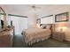 Cozy bedroom with carpet, ceiling fan, and plenty of natural light from the large windows at 3550 Bay Sands Dr # 3089, Laughlin, NV 89029