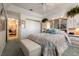 Comfortable bedroom features soft carpet, neutral paint, ceiling fan, and attached bathroom at 3550 Bay Sands Dr # 3089, Laughlin, NV 89029