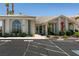 Attractive commercial building with arched windows, a glass door entrance, and desert landscaping at 3550 Bay Sands Dr # 3089, Laughlin, NV 89029