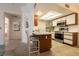 Bright kitchen boasts stainless steel appliances, a breakfast bar, and tile flooring at 3550 Bay Sands Dr # 3089, Laughlin, NV 89029