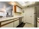Contemporary kitchen featuring stainless steel dishwasher, white cabinets, and modern lighting at 3550 Bay Sands Dr # 3089, Laughlin, NV 89029
