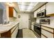 Well-lit kitchen features white cabinets with stainless steel appliances and tile floors at 3550 Bay Sands Dr # 3089, Laughlin, NV 89029