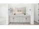 Bathroom featuring double sink vanity with large mirror at 364 Tigullio Ave, Henderson, NV 89011