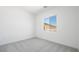 Simple bedroom with neutral carpet and view of mountains at 364 Tigullio Ave, Henderson, NV 89011