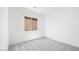 Bright, carpeted bedroom with a window at 364 Tigullio Ave, Henderson, NV 89011