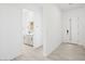 Modern entryway with tile flooring, white walls, and entry to the bathroom at 364 Tigullio Ave, Henderson, NV 89011