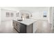 Spacious kitchen with large island, stainless steel appliances, and bright lighting at 364 Tigullio Ave, Henderson, NV 89011