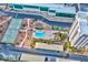 Residential area showcasing a pool, tennis court, storage facilities and the building's parking lot at 3930 University Center Dr # 412, Las Vegas, NV 89119