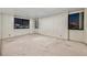 Spacious bedroom with natural light and impressive views from expansive windows at 3930 University Center Dr # 412, Las Vegas, NV 89119