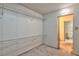Walk-in closet featuring carpet, lighting, and open wire shelving with easy access to the adjacent bathroom at 3930 University Center Dr # 412, Las Vegas, NV 89119