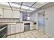 Practical kitchen layout with modern dishwasher and tile flooring for easy maintenance at 3930 University Center Dr # 412, Las Vegas, NV 89119